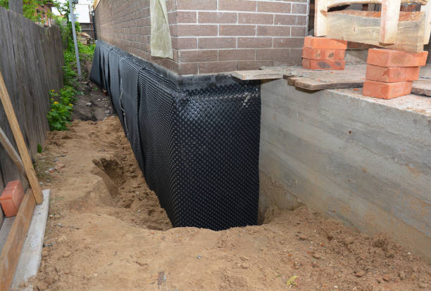 Happy homeowners after waterproofing job in Weston